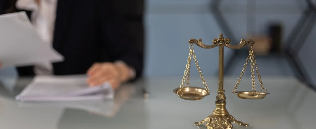 Scales of justice on a desk in a law office