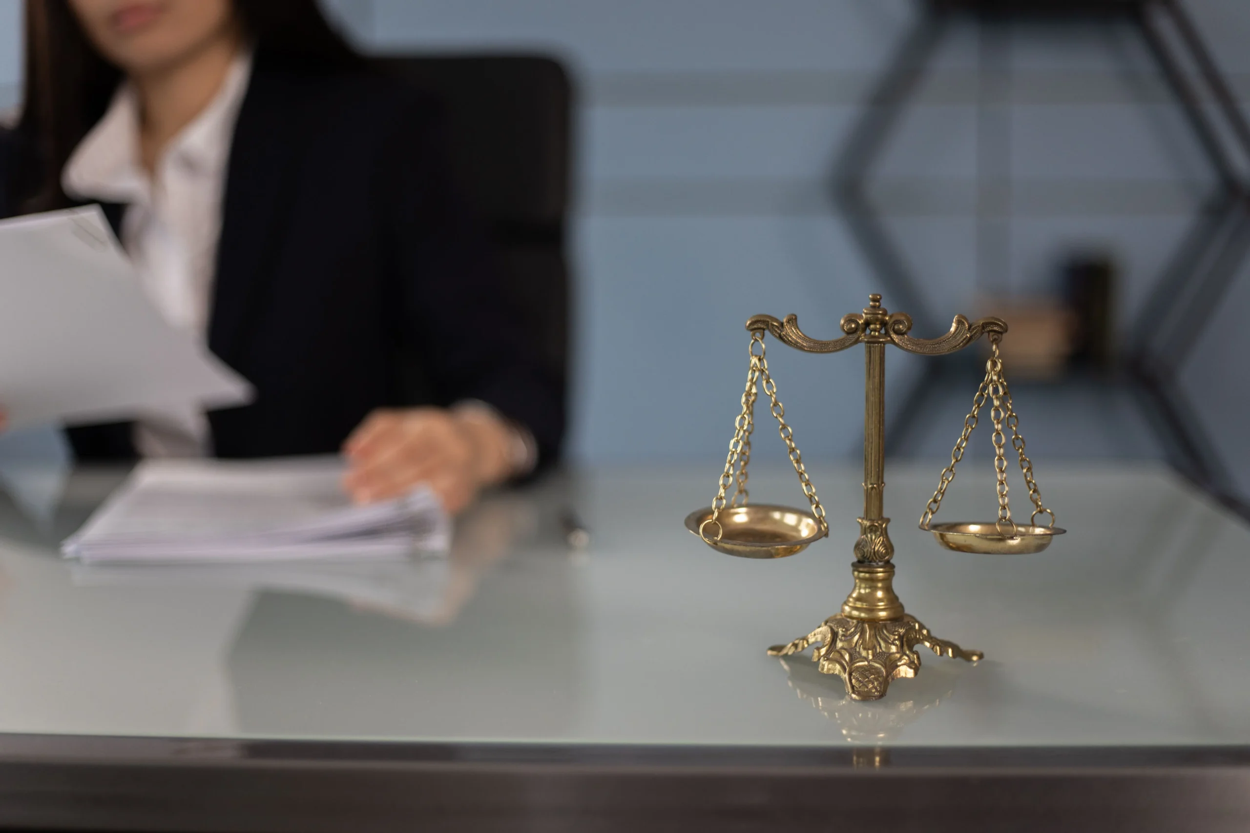 Scales of justice on a desk in a law office