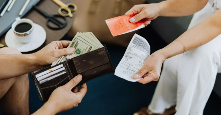 Calculator and bills on a desk, the financial pressure a bankruptcy client arrives with