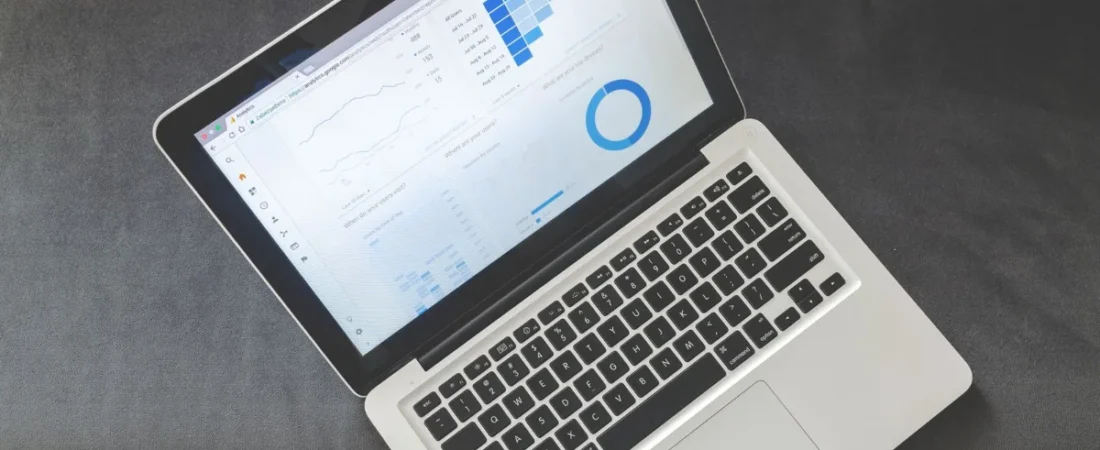 Laptop showing a marketing analytics dashboard with charts