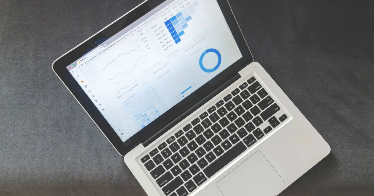 Laptop showing a marketing analytics dashboard with charts