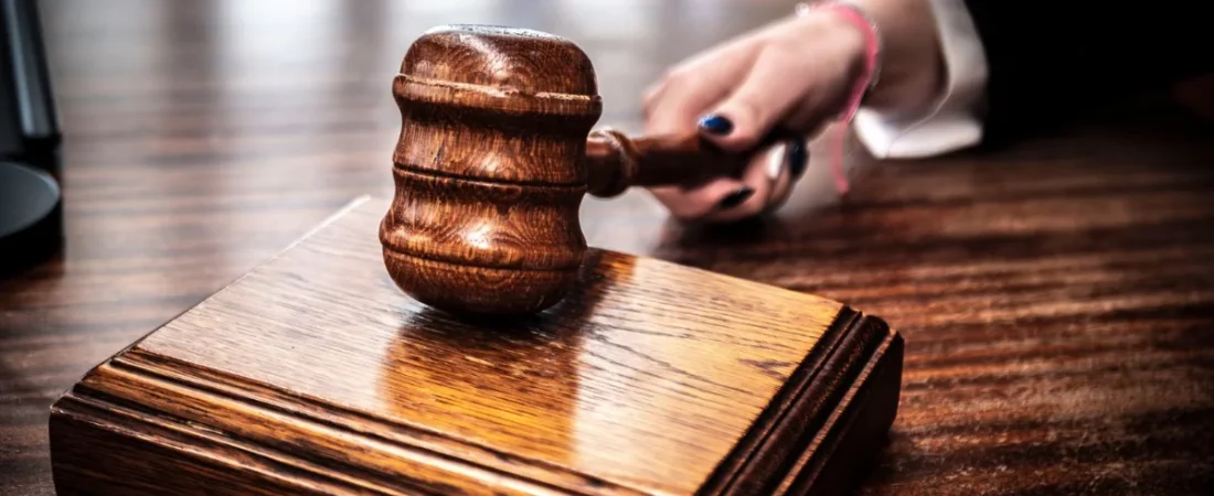 Wooden gavel on a courtroom bench
