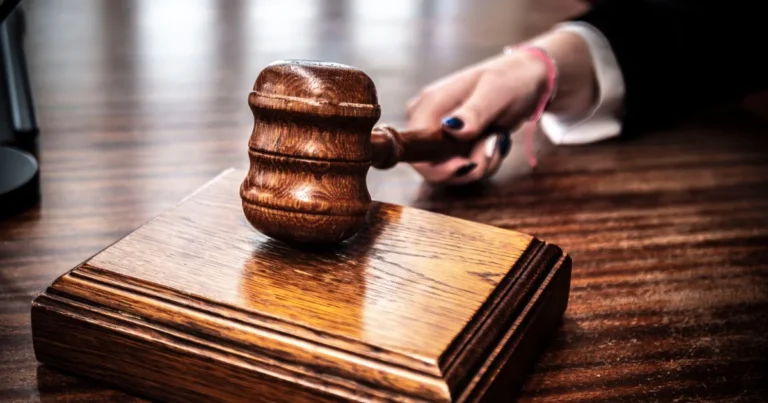 Wooden gavel on a courtroom bench