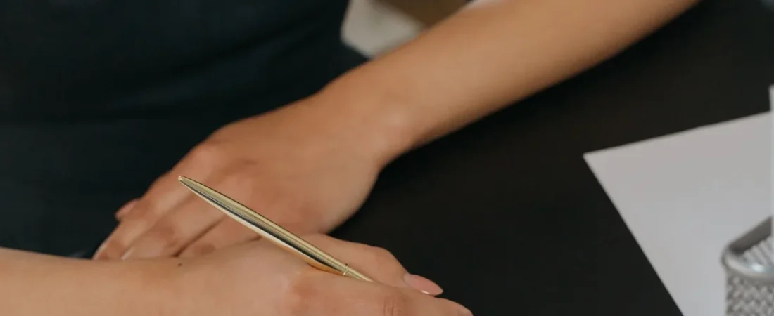 Signing family law paperwork at a desk