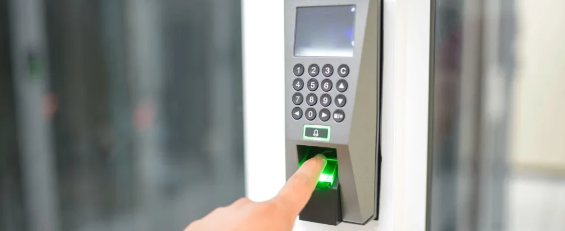 Employee using a fingerprint timeclock scanner
