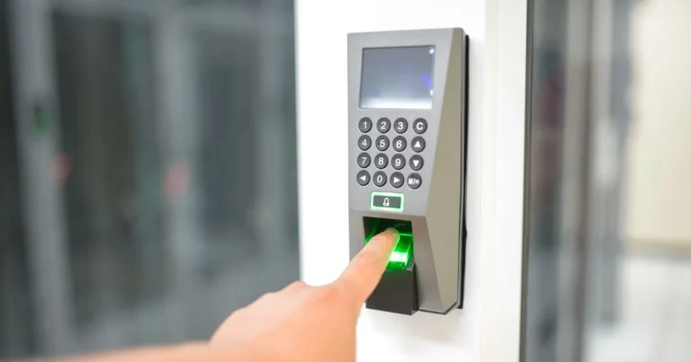 Employee using a fingerprint timeclock scanner