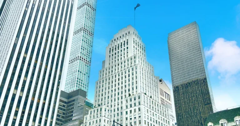 Manhattan office towers against a blue sky