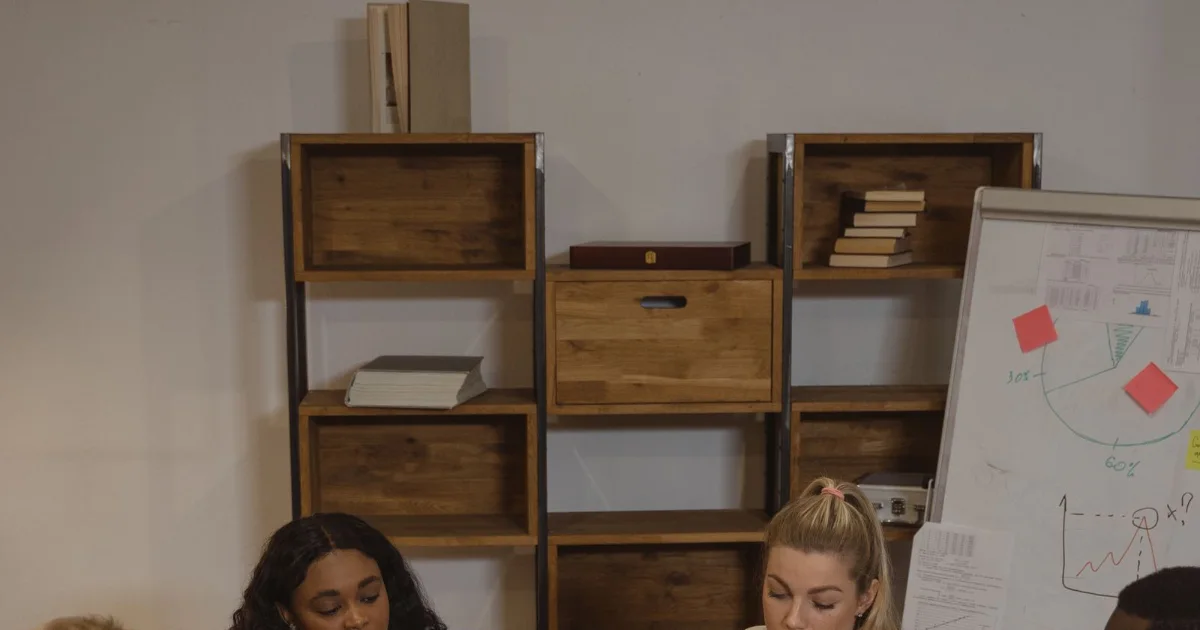 Colleagues discussing a workplace issue at a table