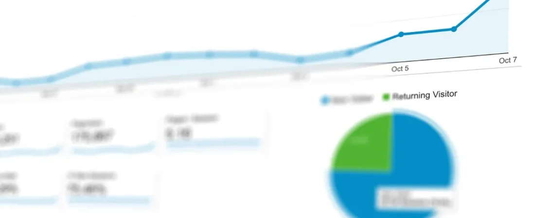 Reports and charts spread on a desk during a website content audit