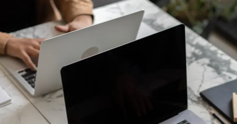 Writer drafting law firm website content at a desk with a laptop and notes