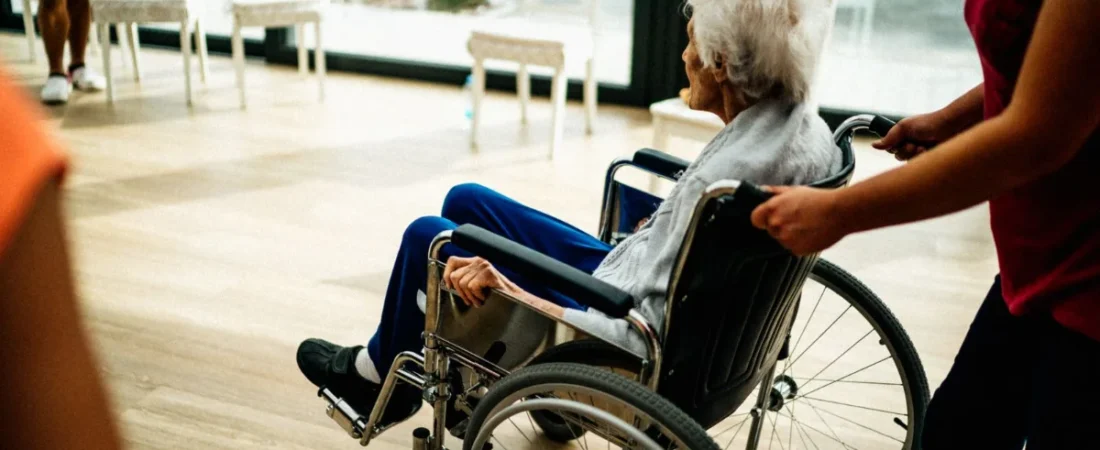 Senior resident in a wheelchair at a nursing home