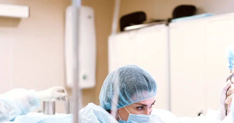 Surgeon operating in a hospital theatre