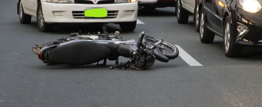 A car with heavy front-end damage after a collision, a typical personal injury claim
