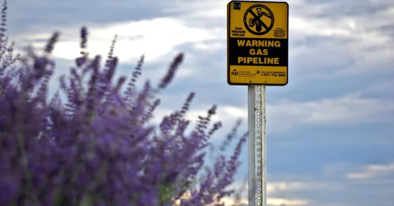 Gas pipeline warning sign on rural land