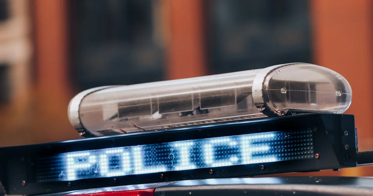 Police car light bar with a lit POLICE sign