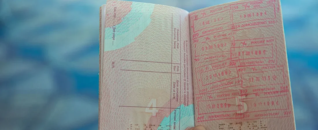 Open passport showing visa and entry stamps