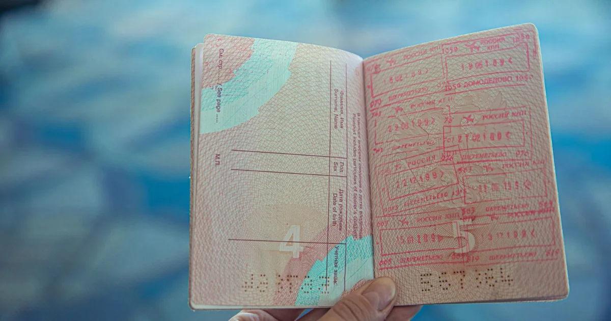 Open passport showing visa and entry stamps