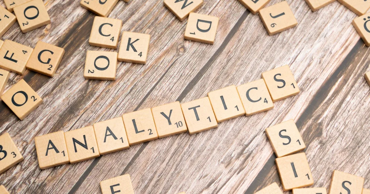 Letter tiles spelling analytics on a wooden table